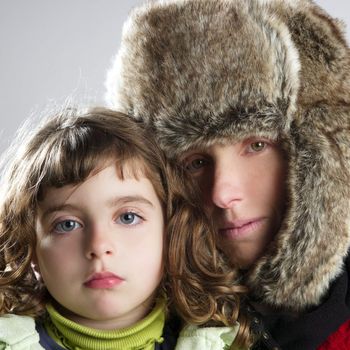 beautiful mother daughter winter portrait fur hat