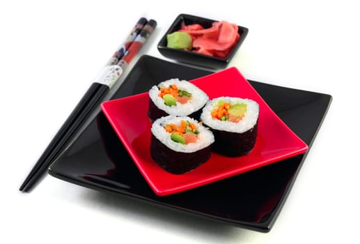 Sushi on black plate on the white background
