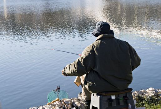 Fisherman into the lake