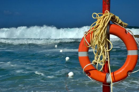 Beach life saver with rough sea and big waves in the background