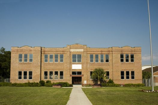 An old school building from a straight-on vantage point.