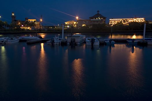 The boat marina and skyline of Cedar Key, Florida, at night.