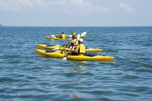 Kayakers enjoy a beautiful day on the Gulf of Mexico near Cedar Key, Florida.