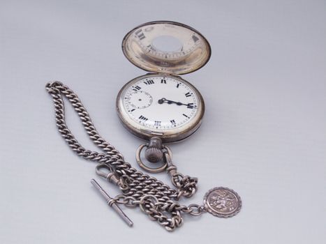 silver pocket watch and chain