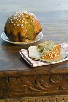 Brioche on a plate with granulated sugar garnish