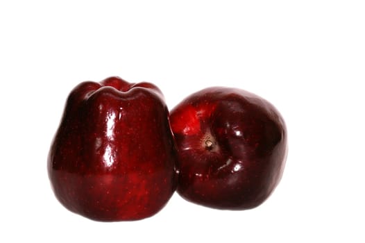 Two big tasty red apples isolated on white