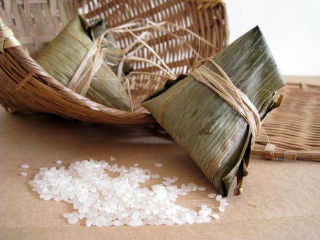 a pyramid-shaped mass of glutinous rice wrapped in leaves, one culture occasion in Chinese