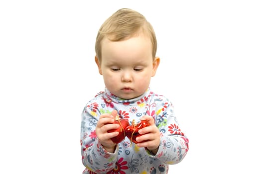 Baby girl with two red glass hearts isolated on white background