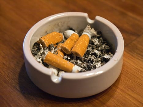 Ashtray full of used Cigarette Butts  Background
