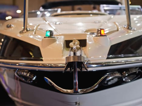 Front close view of a speedboat bow with an anchor