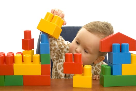 Cute baby girl with colorful blocks isolted background