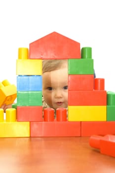 Cute baby girl with colorful blocks isolted background