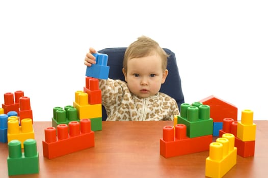 Cute baby girl with colorful blocks isolted background