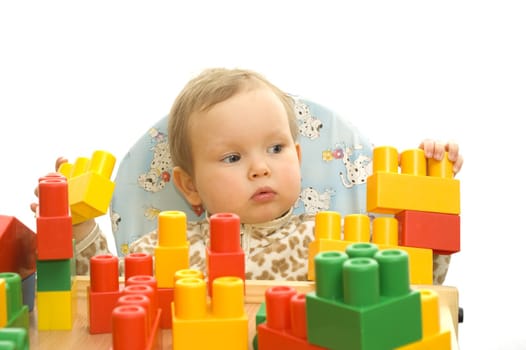 Cute baby girl with colorful blocks isolted background