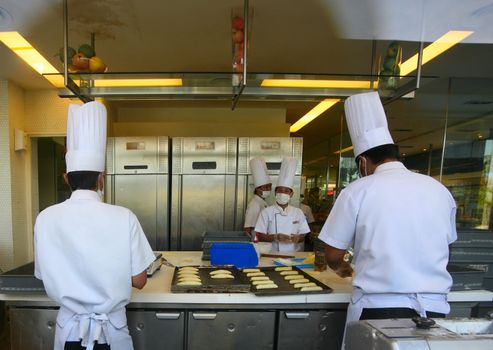 The cooks produces a dessert