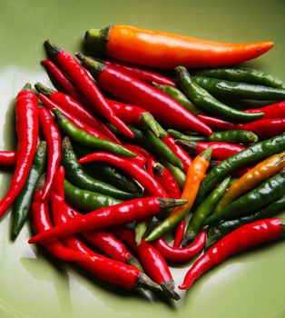 Red, green and yellow hot chilli peppers