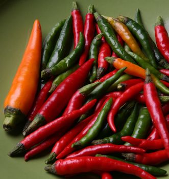 Hot pepper on a green background