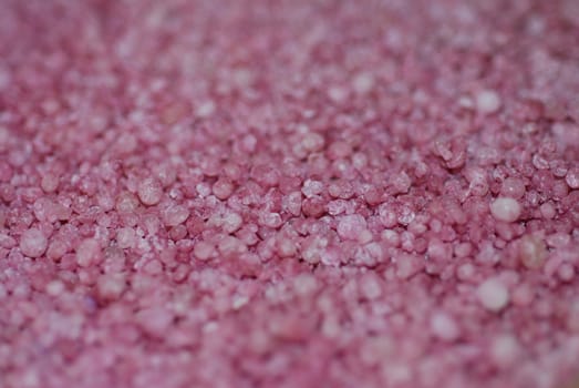 An abstract photograph of pink granules, ideal as a background.