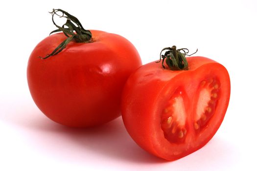 Tomato and half of tomato on a white background