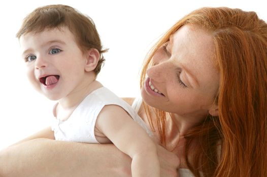 baby and mom in love hug over white studio background