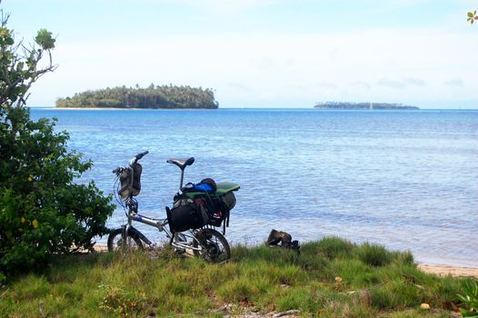 Folding bicycle at Pacific sea coast, Tonga