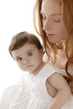 baby and mom in love hug over white studio background