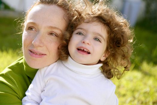 mother and daughter outdoor park green grass together