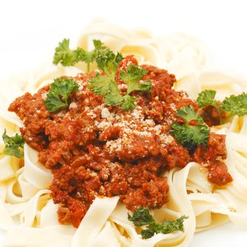 Spaghetti bolognese on white plate close-up