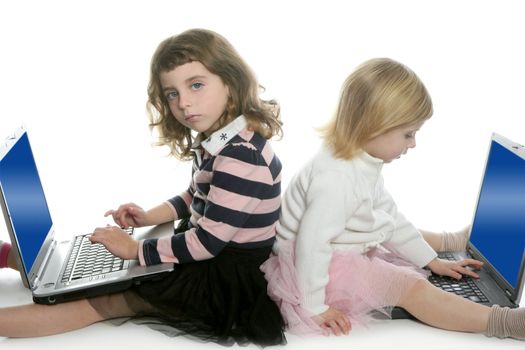 two little girls sister studying computer laptops at school