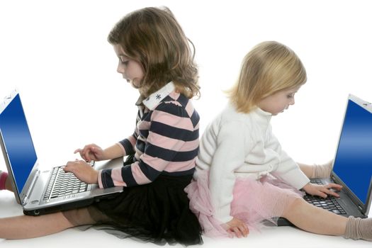 two little girls sister studying computer laptops at school