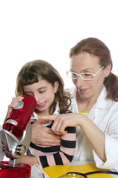 Doctor woman teacher and pupil looking toy microscope