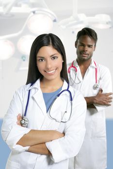 Couple of doctors asian indian woman and african man in the surgery hospital
