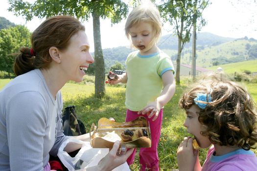 Chocolate picnic birthday family party with mother and daughters