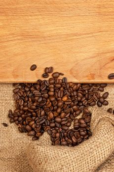 scattered grains of coffee and wooden board