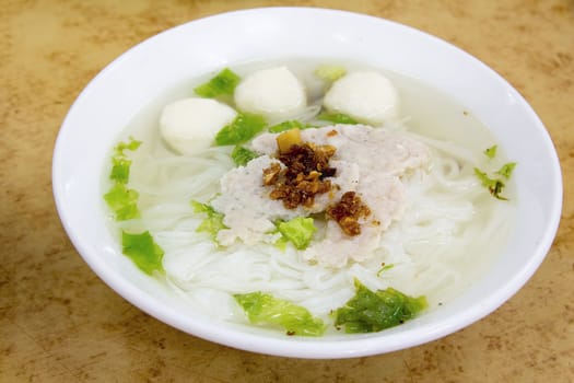 Southeast Asian Fishball Noodle Soup with Pork Patty and Pork Lard Closeup