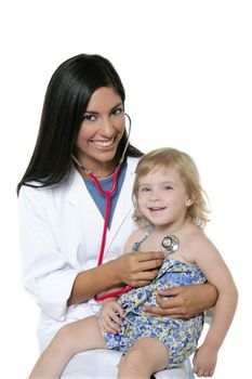 Brunette pediatric doctor with blond little girl on medical exam