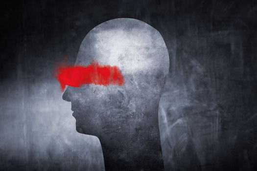Conceptual image of an abstract head with red paint over the eyes.