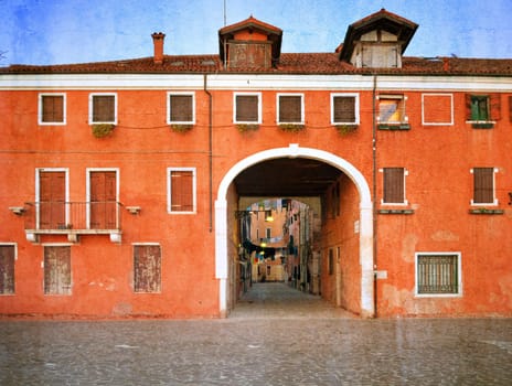 Old Venetian yard, Italy.Photo in old color image style.