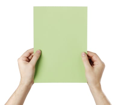 Man holding a blank light green paper against white background.