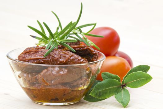 dried tomatoes, fresh tomatoes and herbs