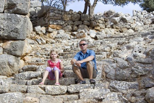 Tourists in the ruins of the ancient city of Lato, Crete
