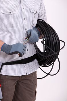 Man preparing length of wire