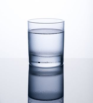 Glass of clear cold water isolated on white background