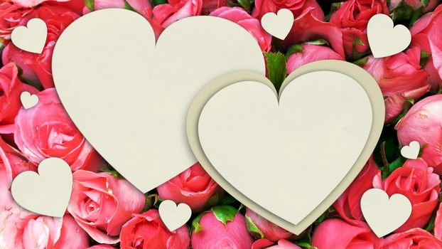 White paper heart form on bouquet of pink roses