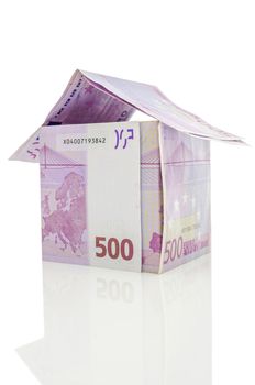 House made of 500 Euro money on a white background.