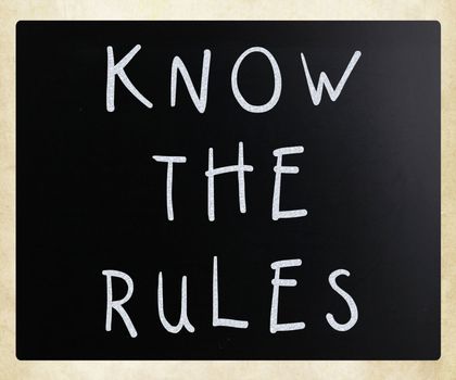 Know the rules - handwritten with white chalk on a blackboard