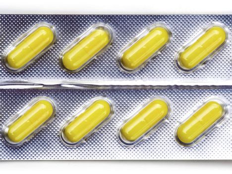 Pack of medical capsules on white.