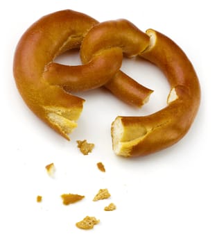 Two isolated pretzel pieces over white background.
