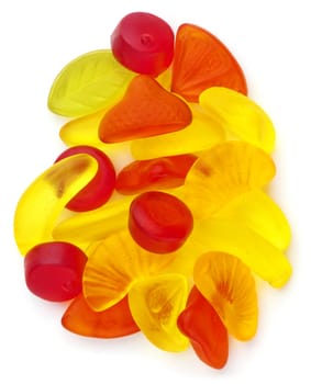 Different fruit jellies in different colors on white background.