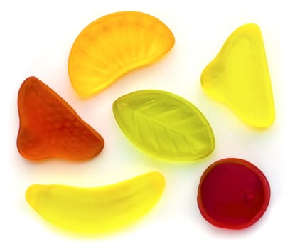 Different fruit jellies in different colors on white background.